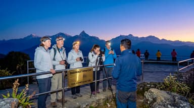 Travelers and guide at viewpoint 202607050955