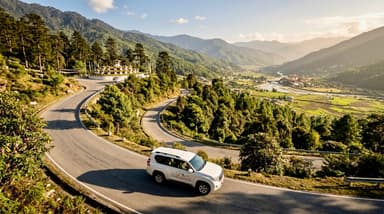 Vehicle winding mountain roads N… 202607052101
