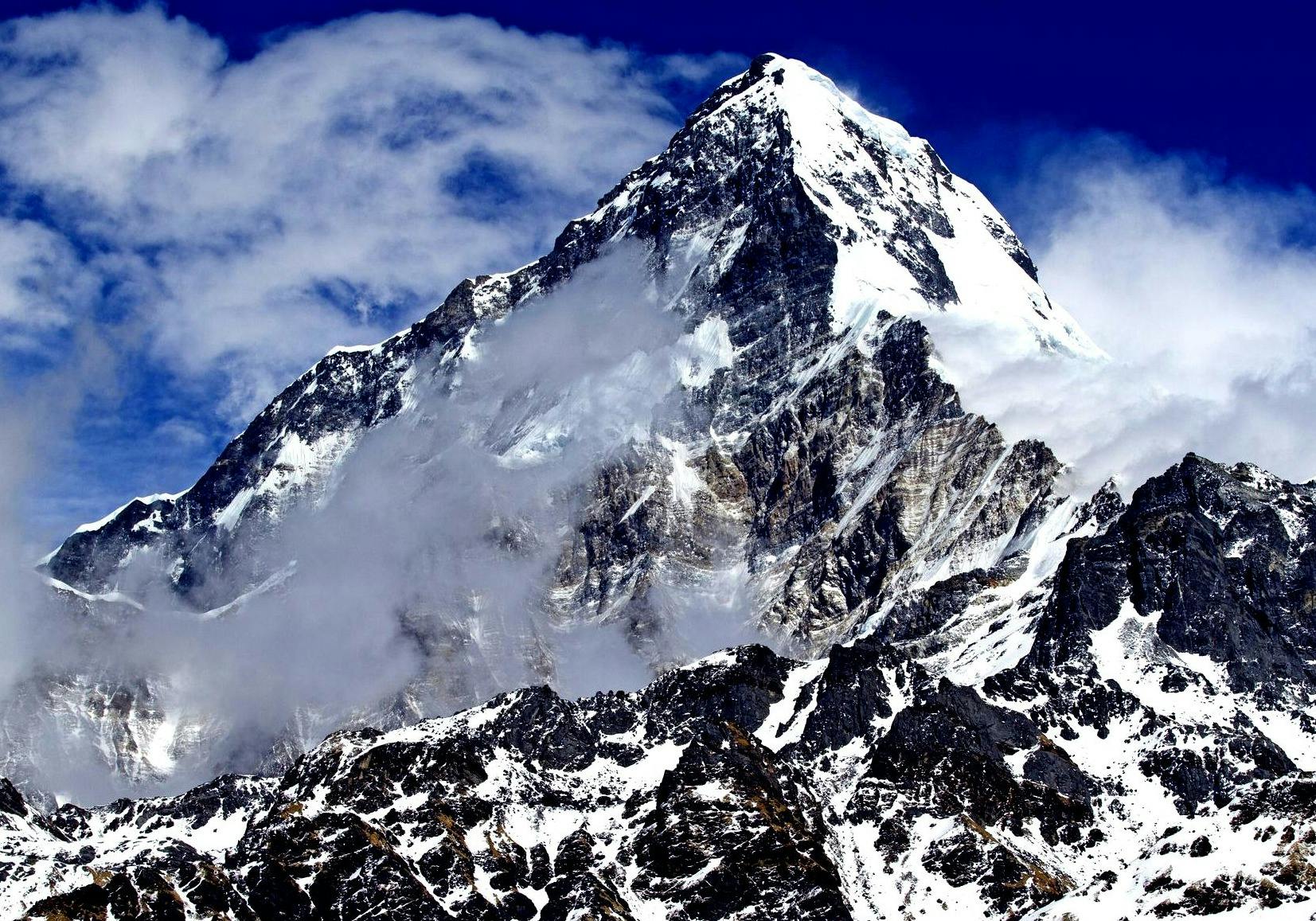 Which is the least-climbed 8000-meter Peak in Nepal?